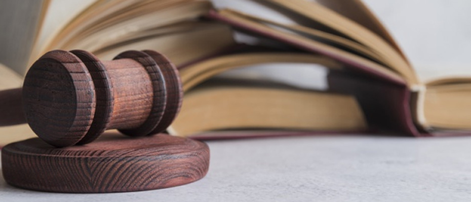 Wooden gavel on law books